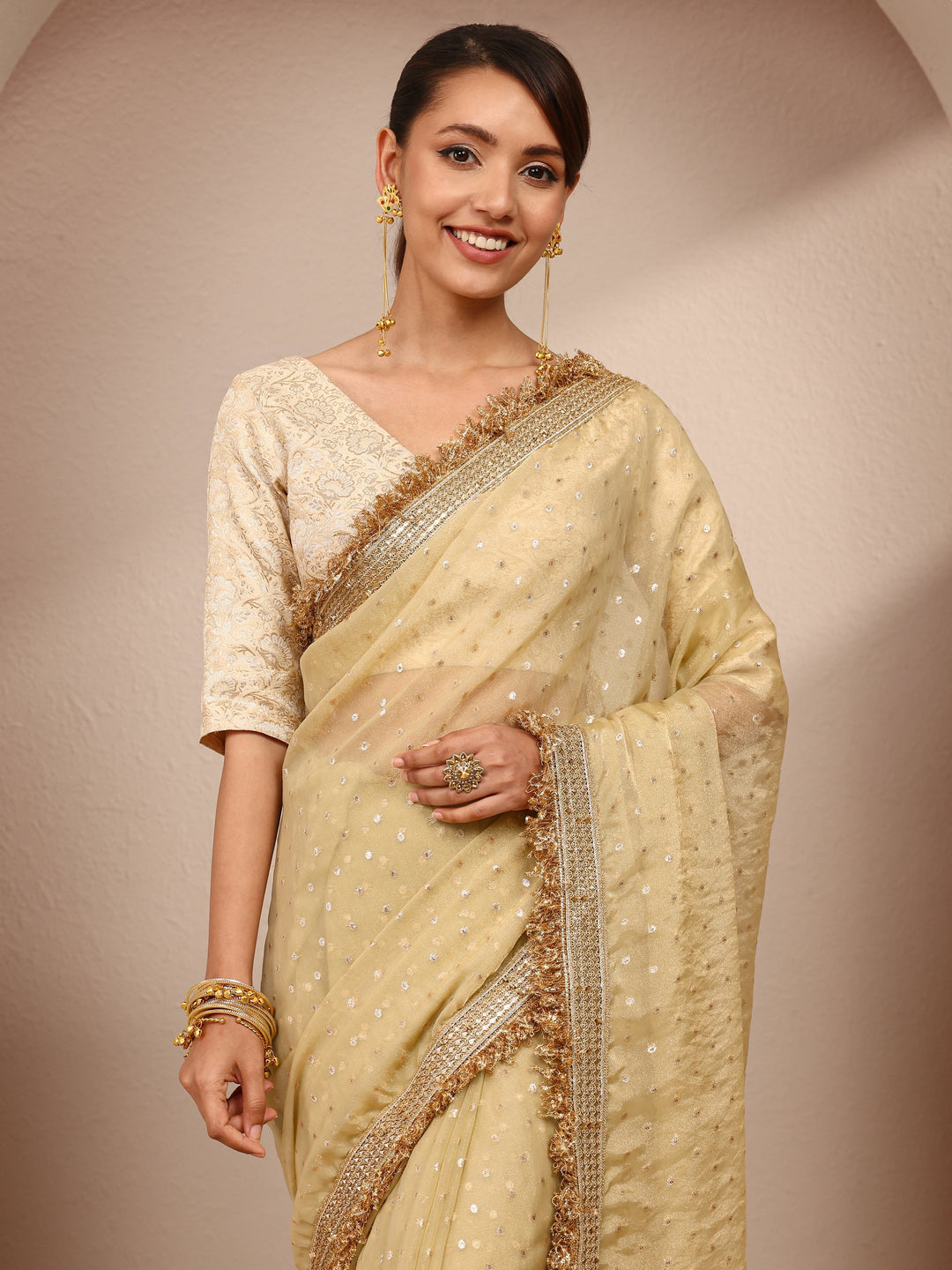  Gold Woven Design Tissue Saree
With Unstitched Blouse Piece 