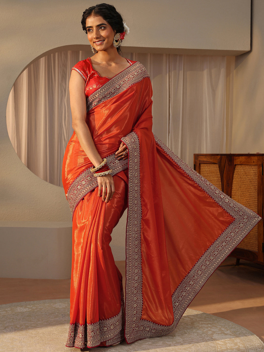  Orange Embellished Border Glossy Satin Saree 