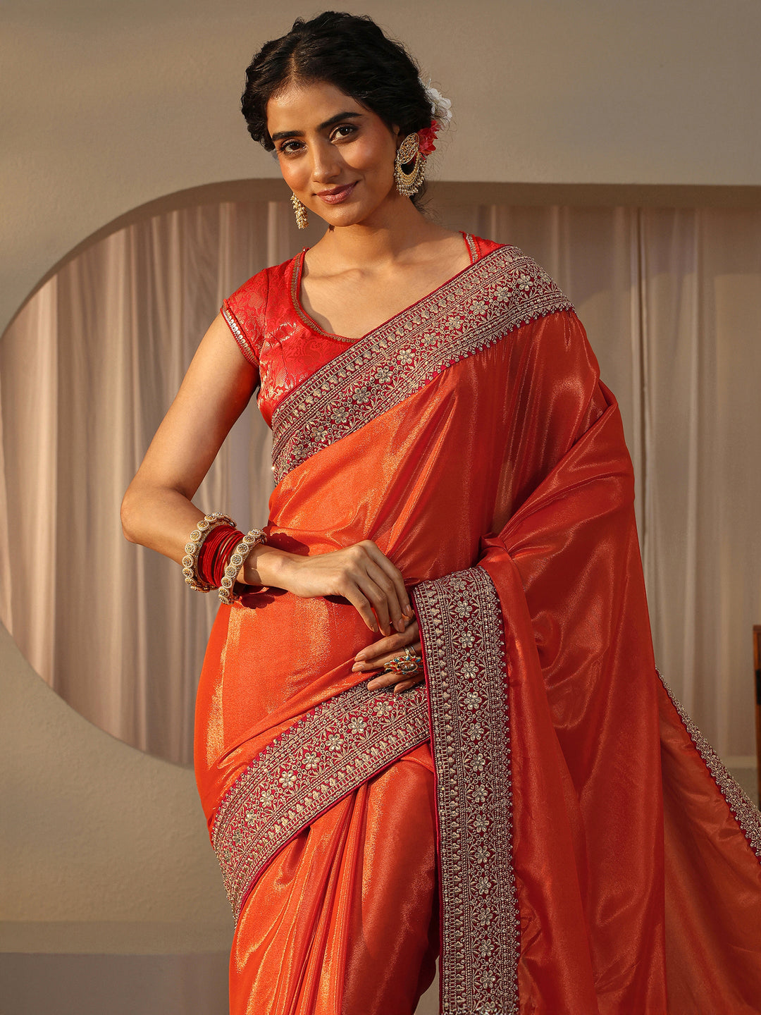  Orange Embellished Border Glossy Satin Saree 