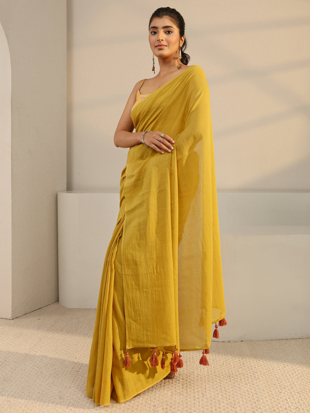  Mustard Solid Cotton Tassel Saree With Unstitched Blouse Piece 