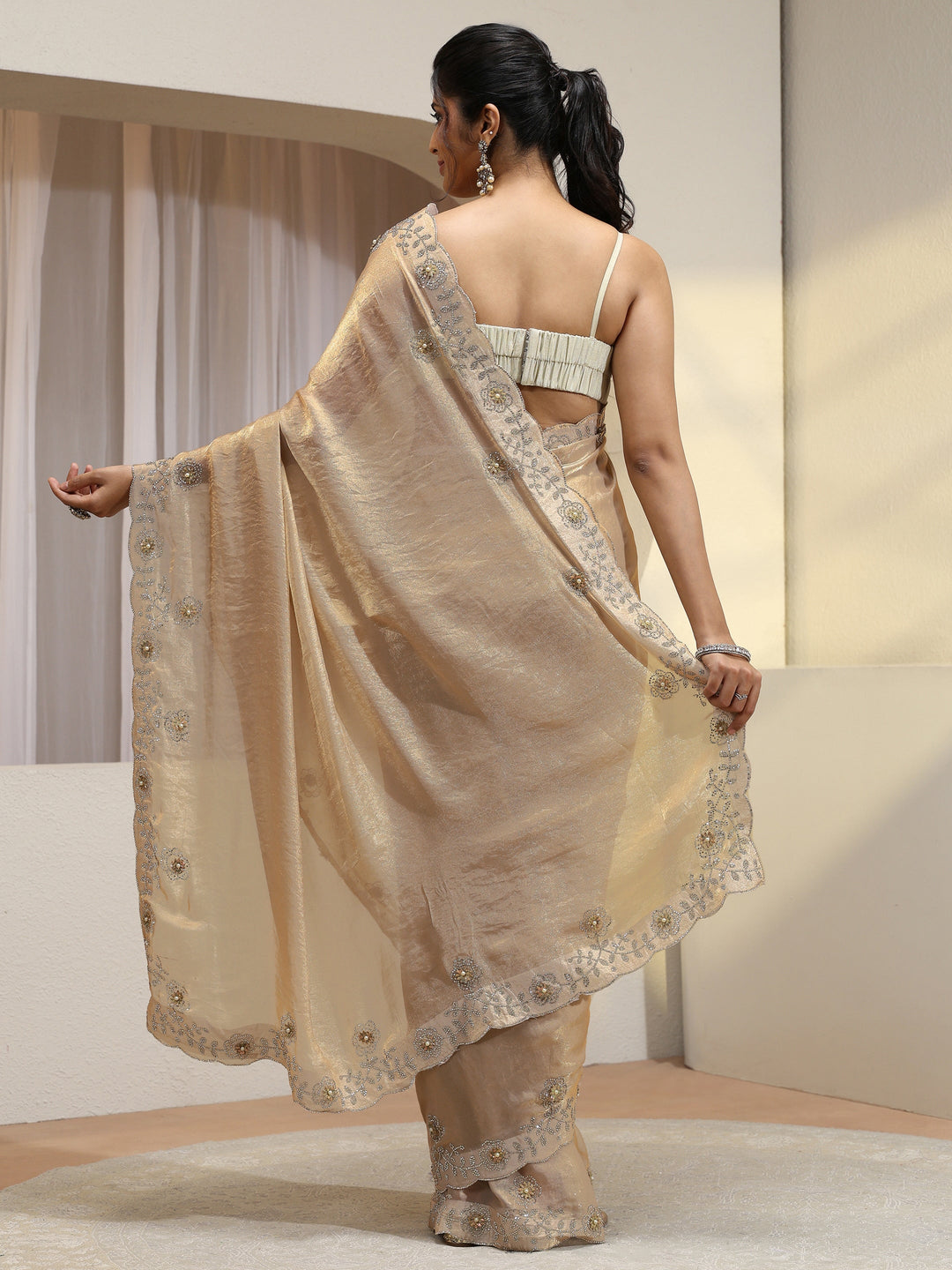  Golden Tissue Saree With Embellished Border 