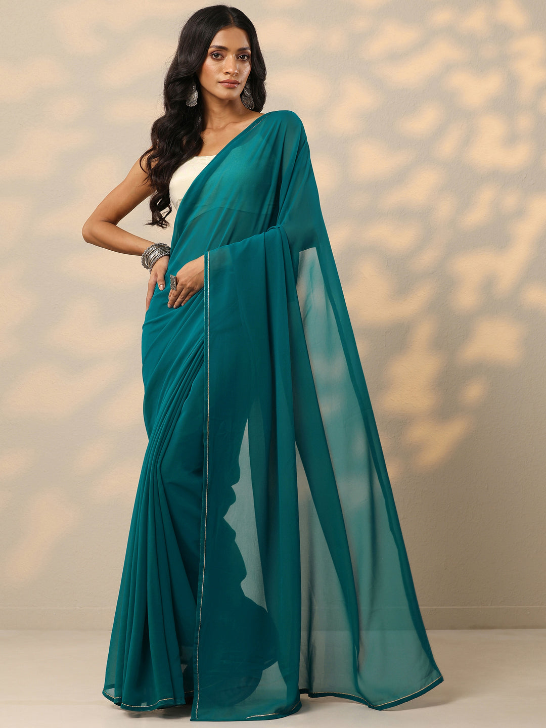  Teal Solid Georgette Saree With Unstitched Blouse Piece 
