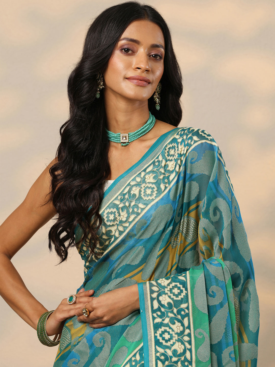  Teal Printed Georgette Saree With Unstitched Blouse Piece 