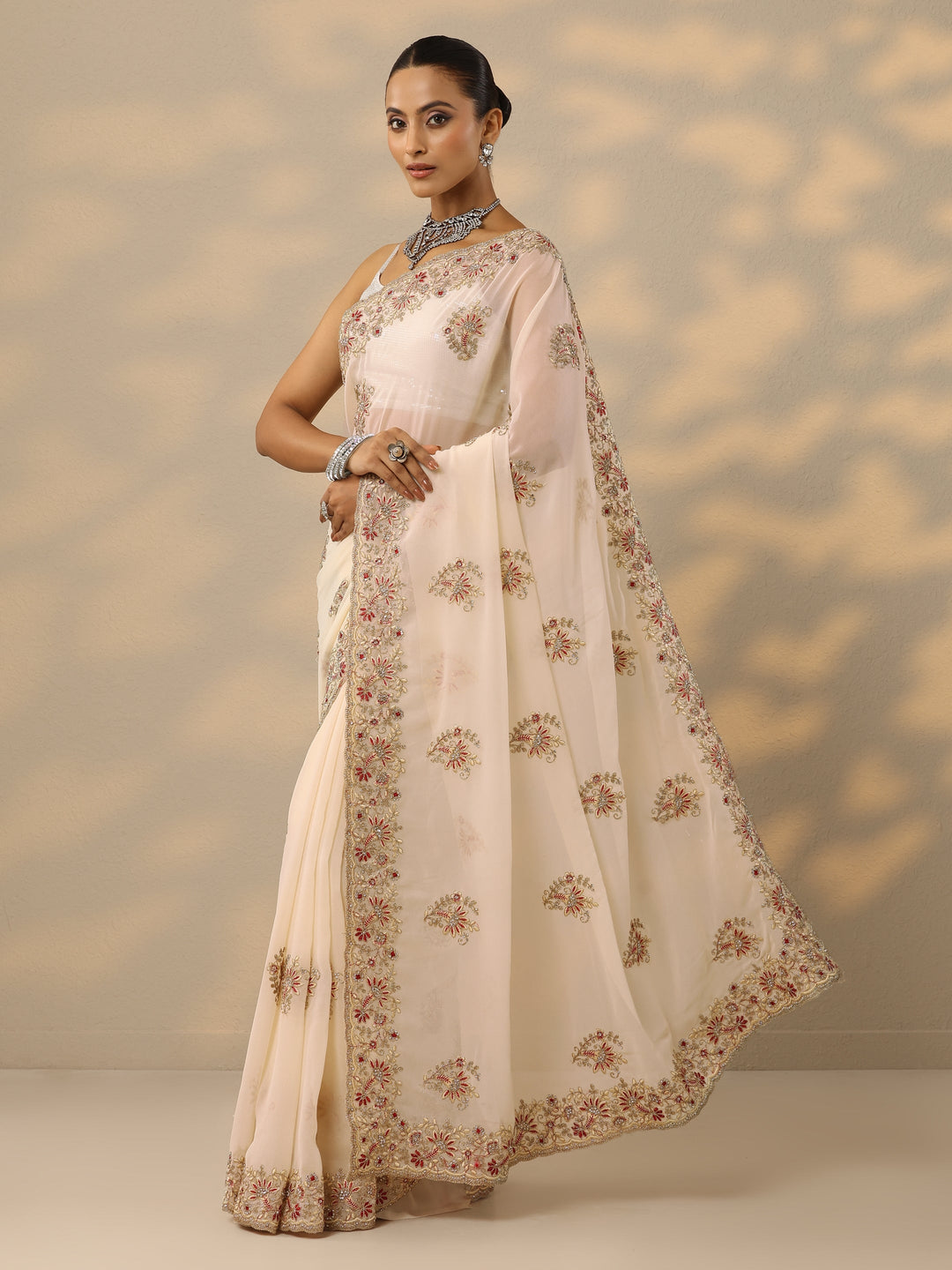  Cream Embellished Georgette Saree With Unstitched Blouse Piece 