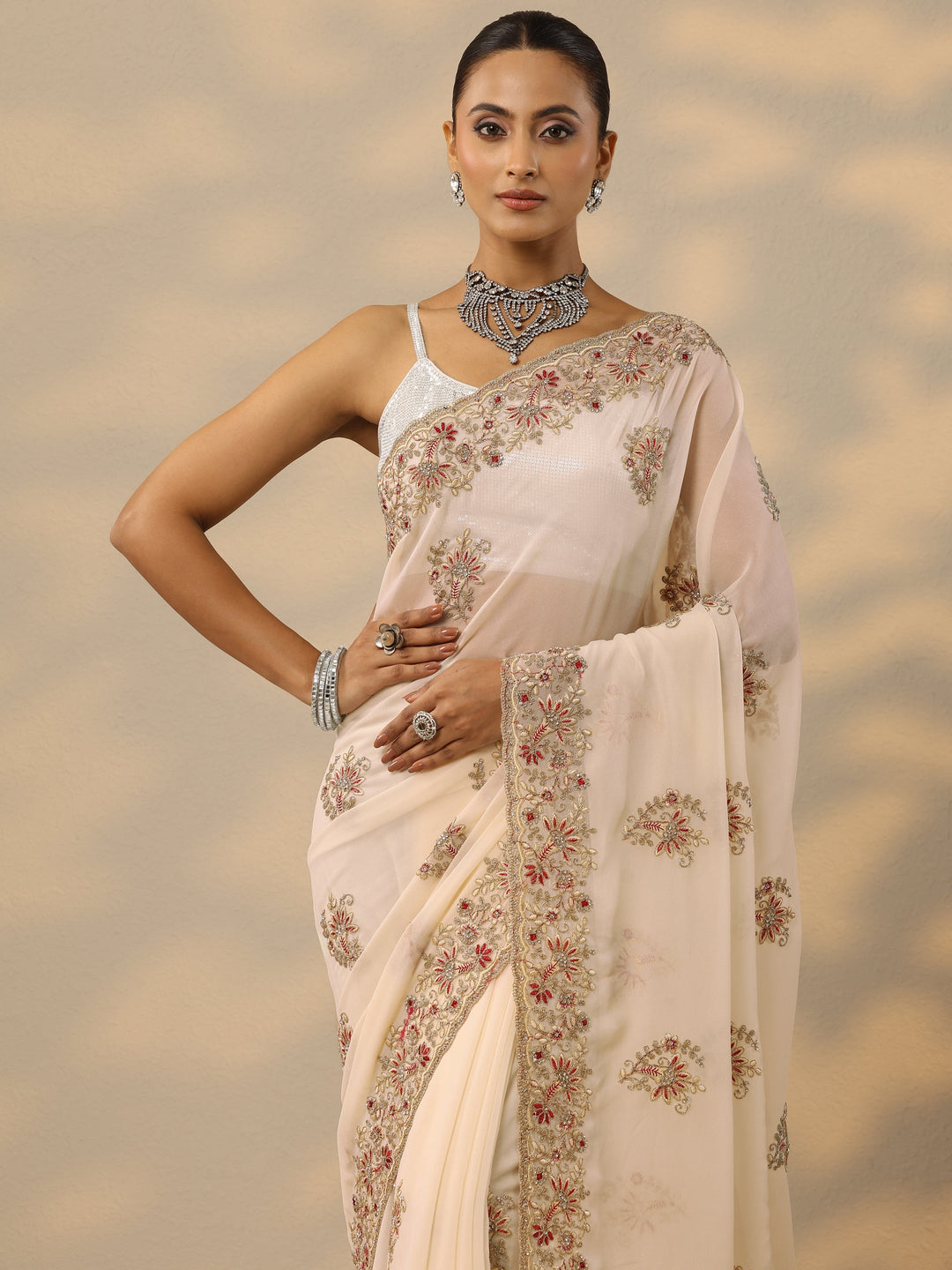  Cream Embellished Georgette Saree With Unstitched Blouse Piece 