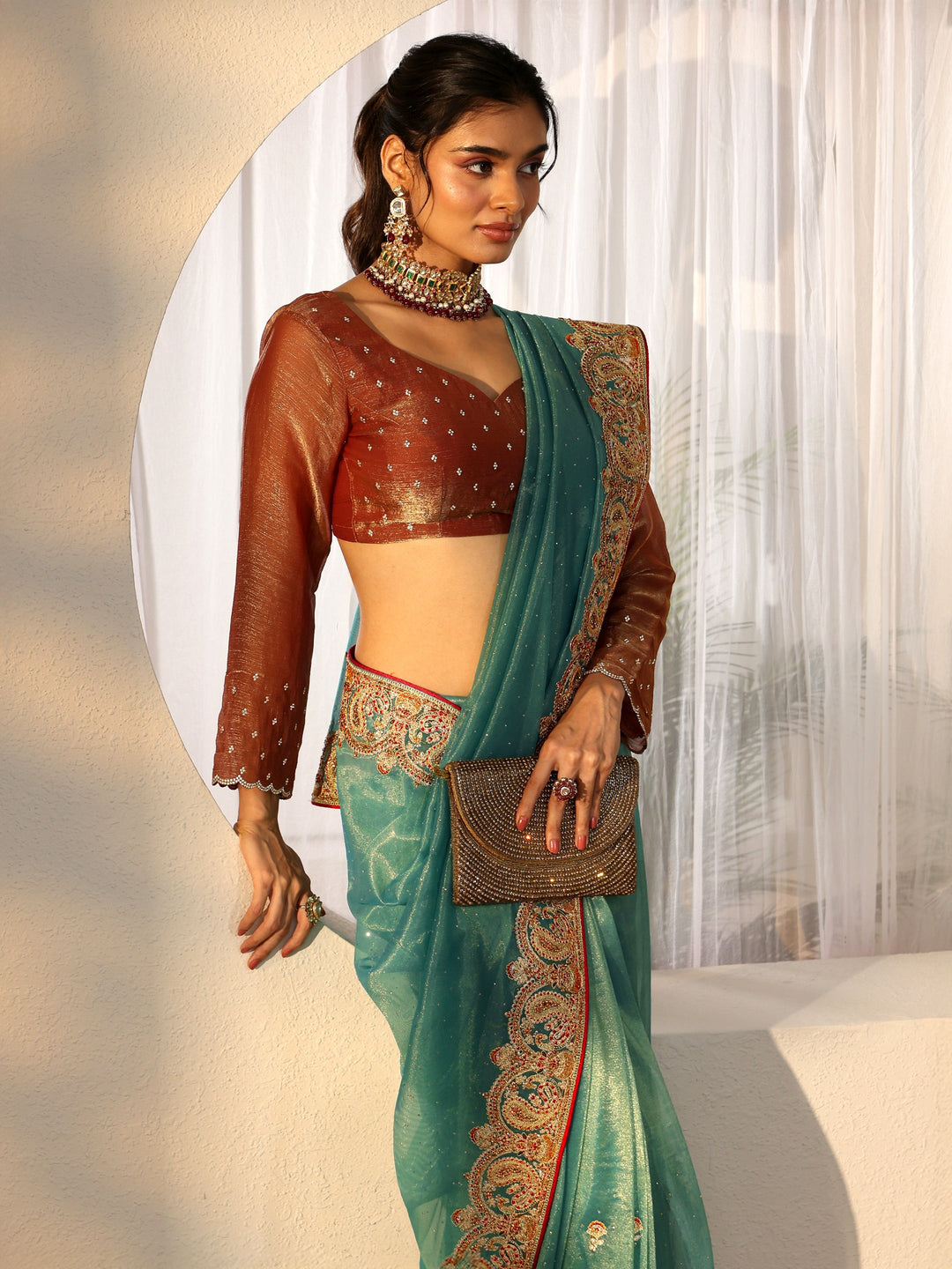  Libas Aqua Blue Net Saree with Embellished Paisley Border 