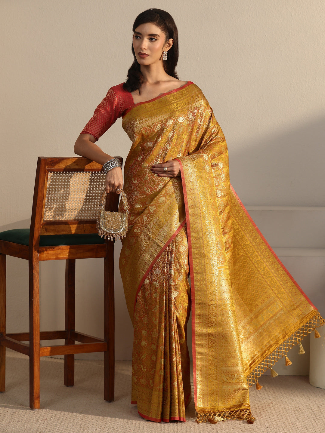 Libas Art Mustard Patola Woven Design Silk Blend Tassel Saree