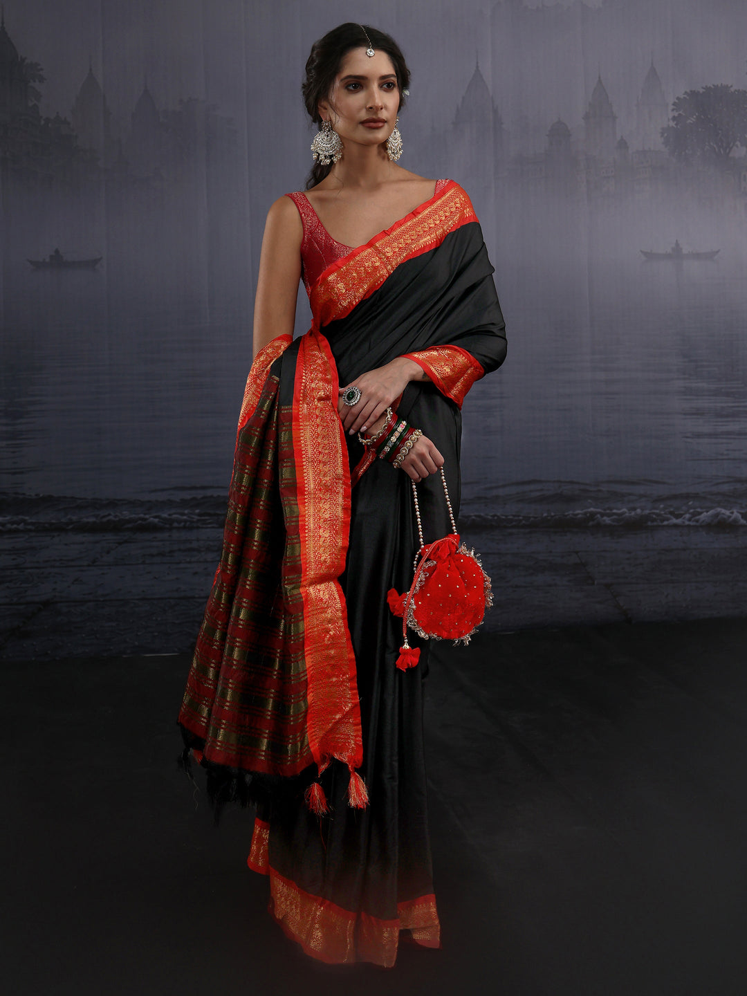 Libas Black and Orange Silk Blend Tassel Saree with Woven Border