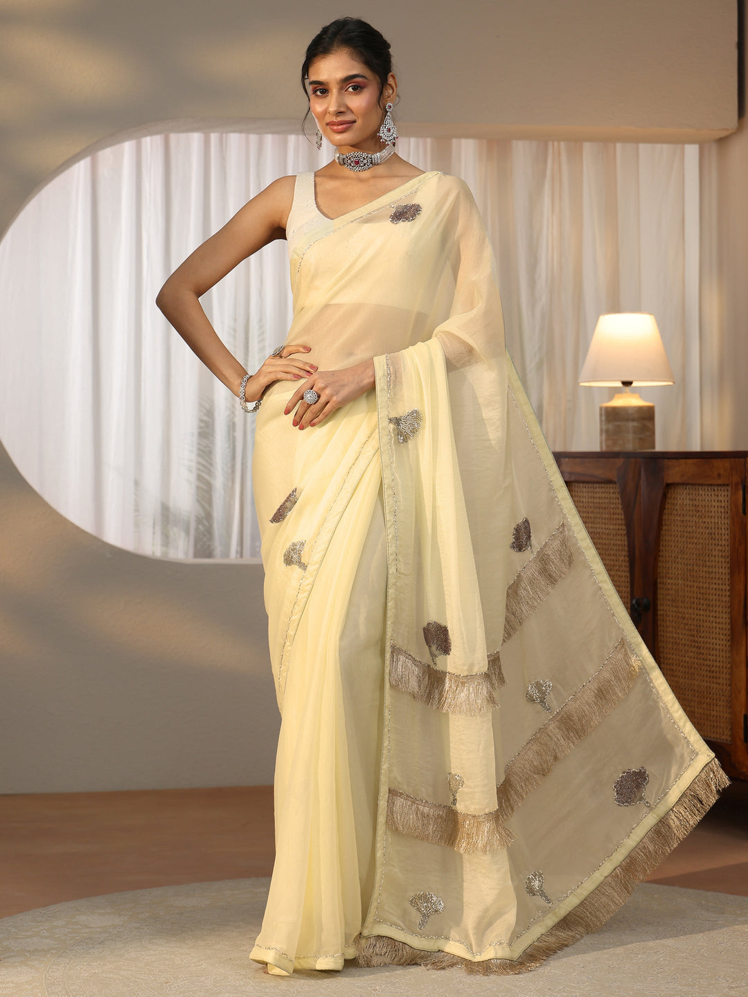  Libas Light Yellow Tissue Saree with Tassel Embellished Pallu 