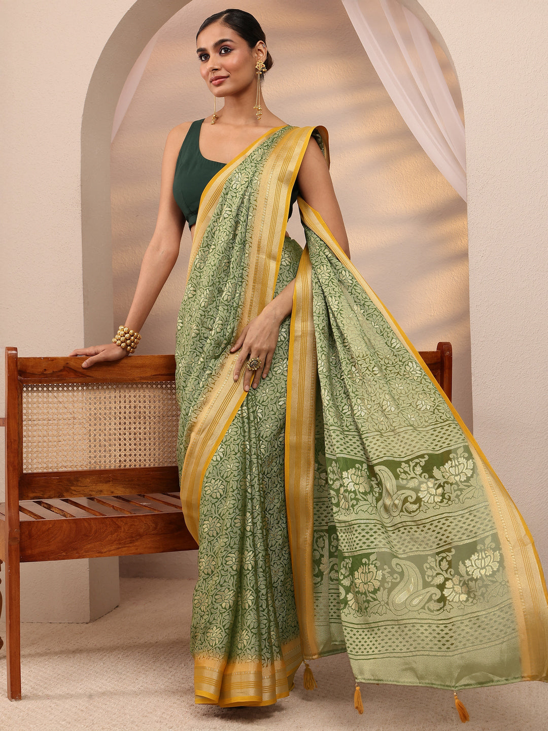 Green Woven Design Silk Blend Saree 
With Unstitched Blouse Piece 