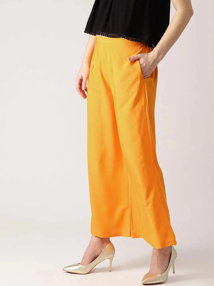 Orange Solid Crepe Palazzos - Libas