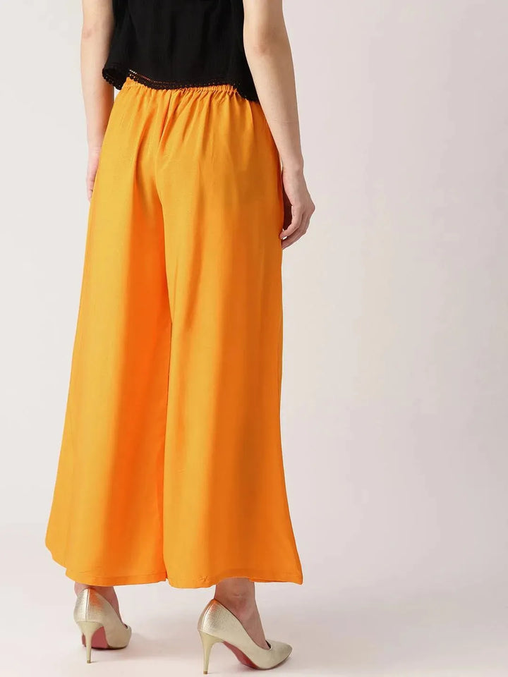Orange Solid Crepe Palazzos - Libas