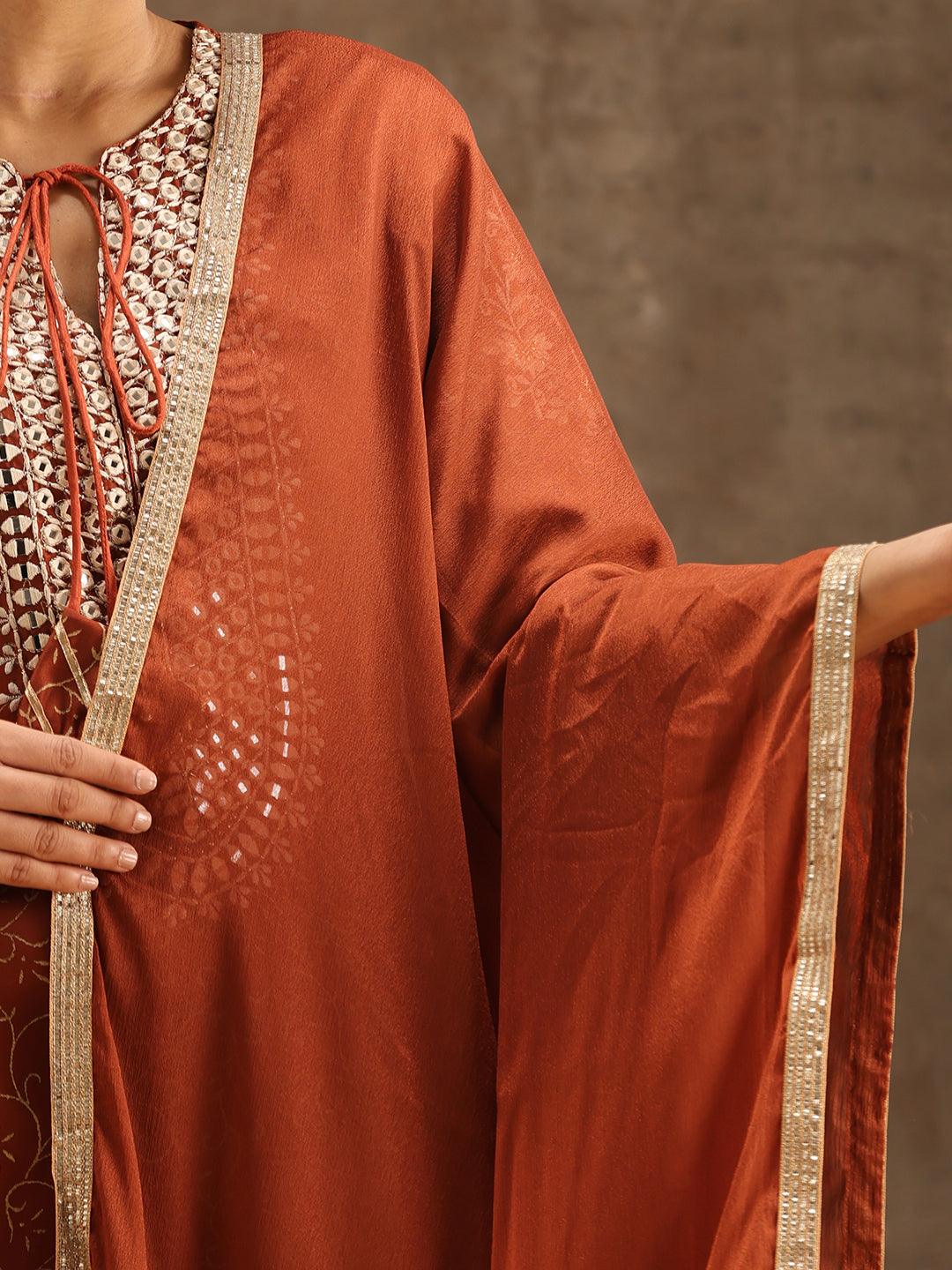 Rust Yoke Design Silk Blend Suit Set With Sharara - Libas